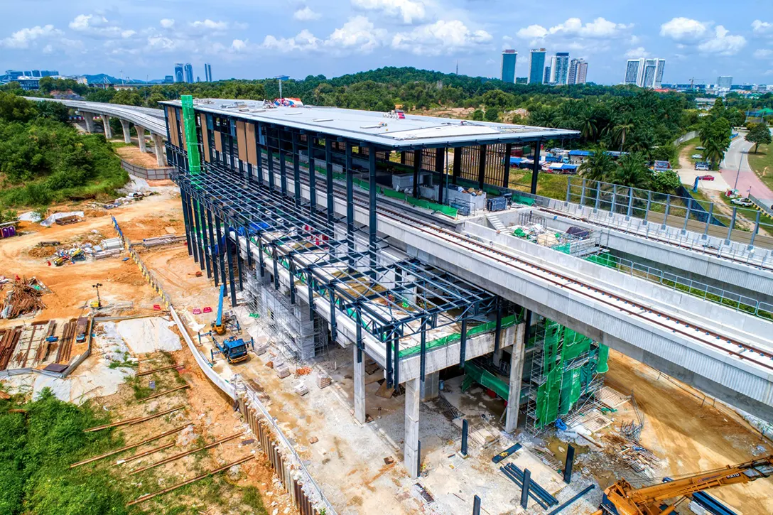 Aerial view of the Cyberjaya City Centre MRT Station site showing the roof covering near completion at station box and entrance steel structure in progress.