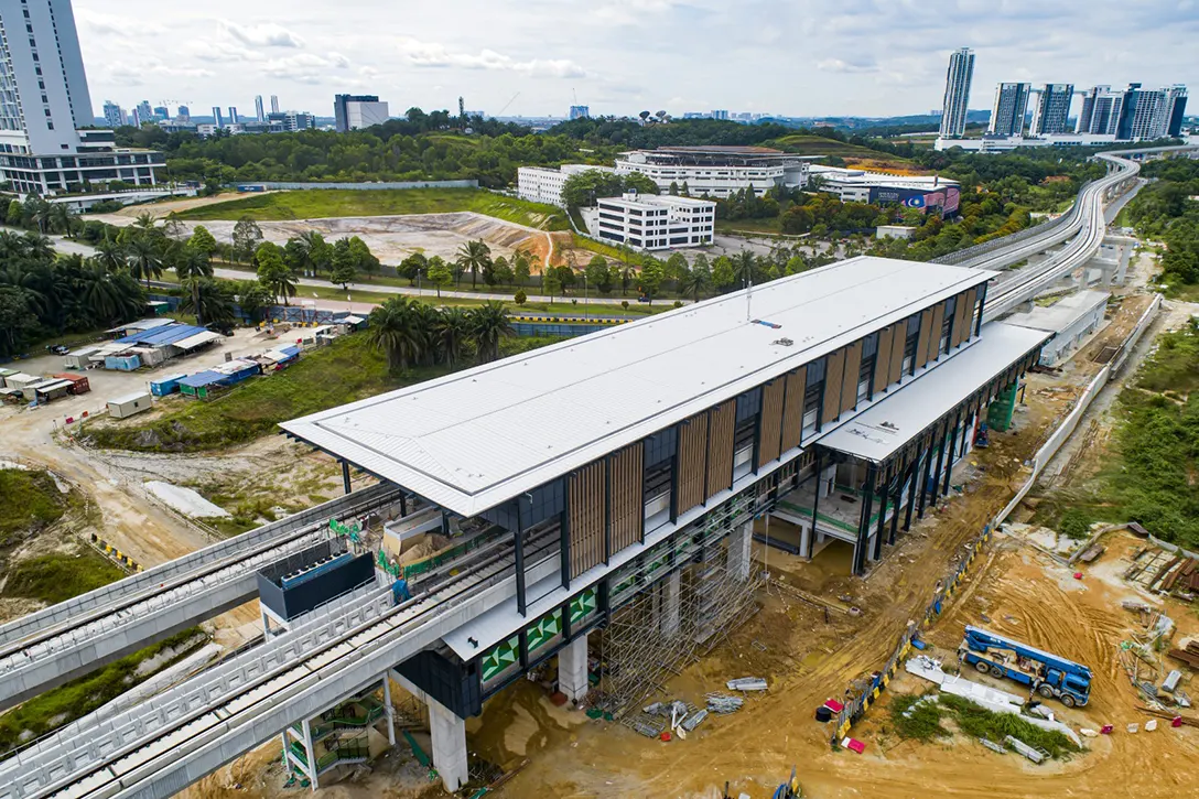 Aerial view of the Cyberjaya City Centre MRT Station showing the tiling installation works in progress at platform and concourse levels as well as mural painting works, façade works at main station and entrance architectural and mechanical and electrical works in progress.