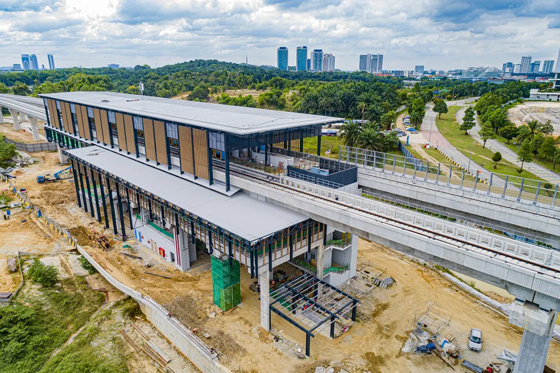 Aerial view of the Cyberjaya City Centre MRT Station site showing external painting works and reinforced concrete wall in progress.